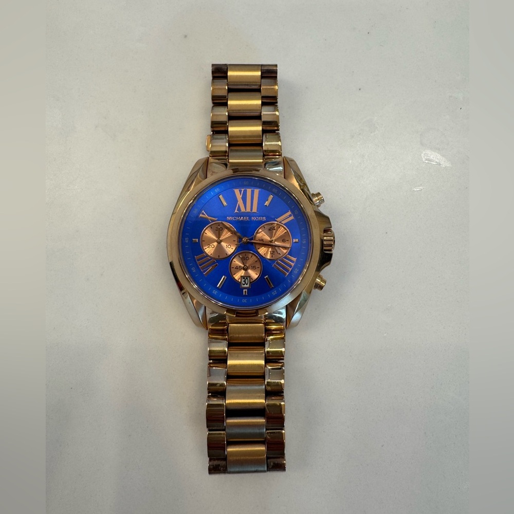 Michael Kors rose gold watch with a Blueface